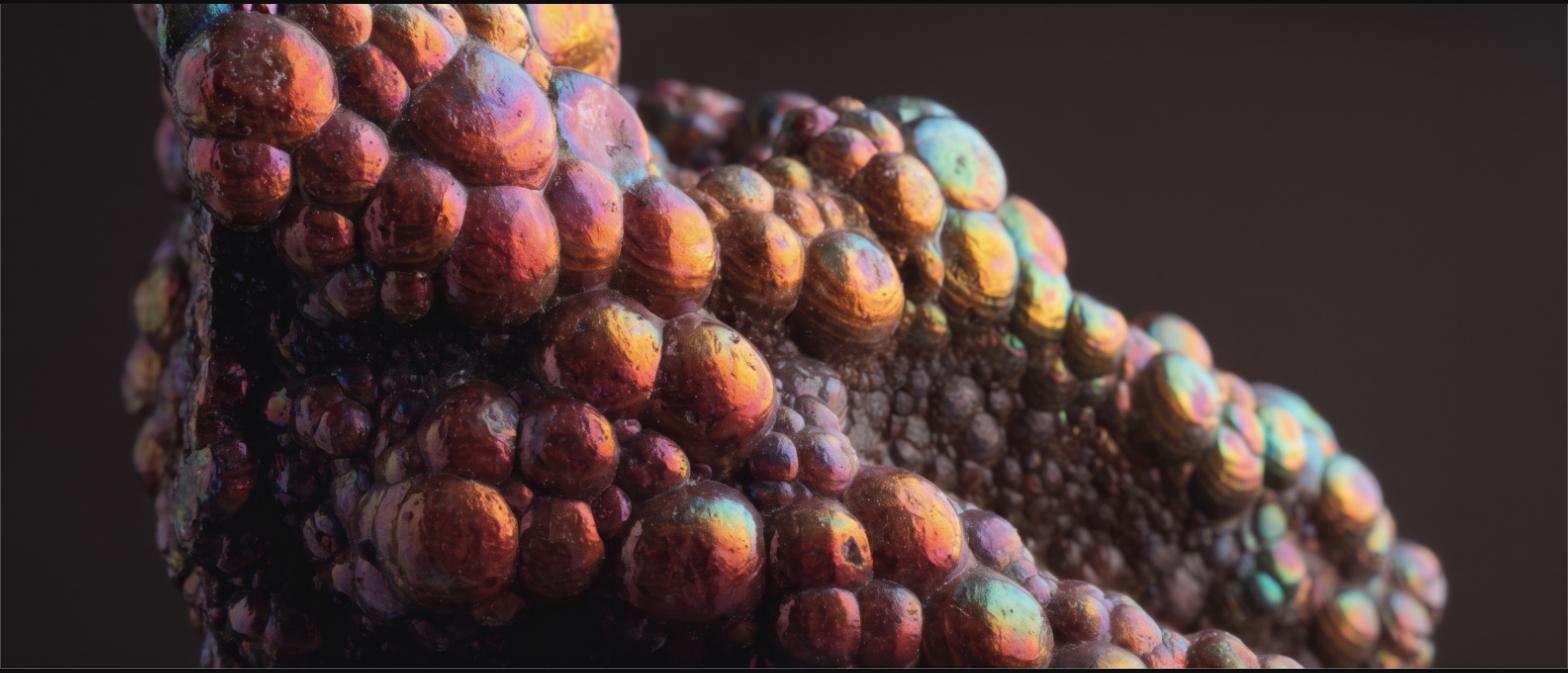 Extreme close-up of the bubbled iridescent surface of a fire agate